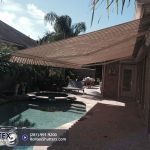 tan retractable awning covering the patio